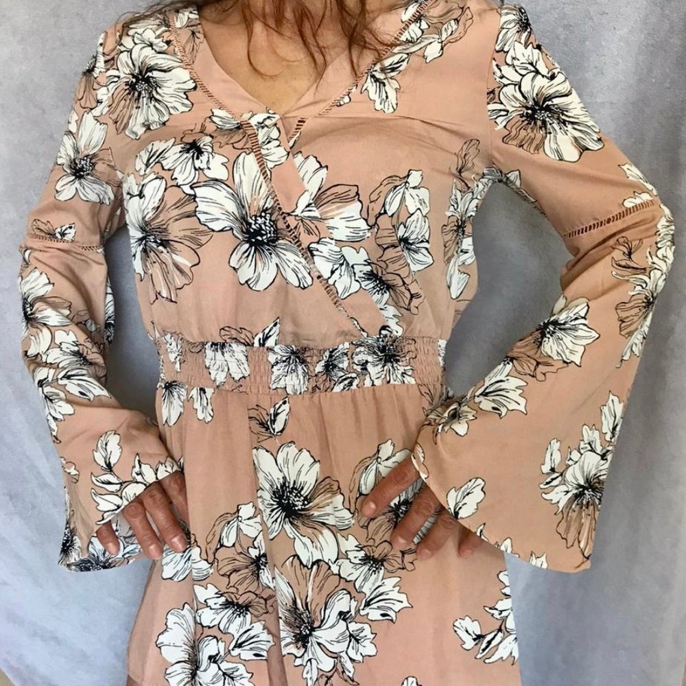 Pink jumper with flower pattern